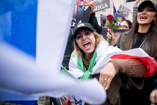 People take part in a rally held outside the US consulate in Edinburgh