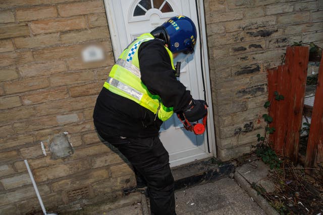 Police executing a warrant in Bradford