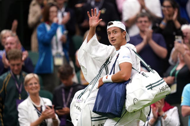 Ryan Peniston waves to the Centre Court crowd after his straight-sets defeat