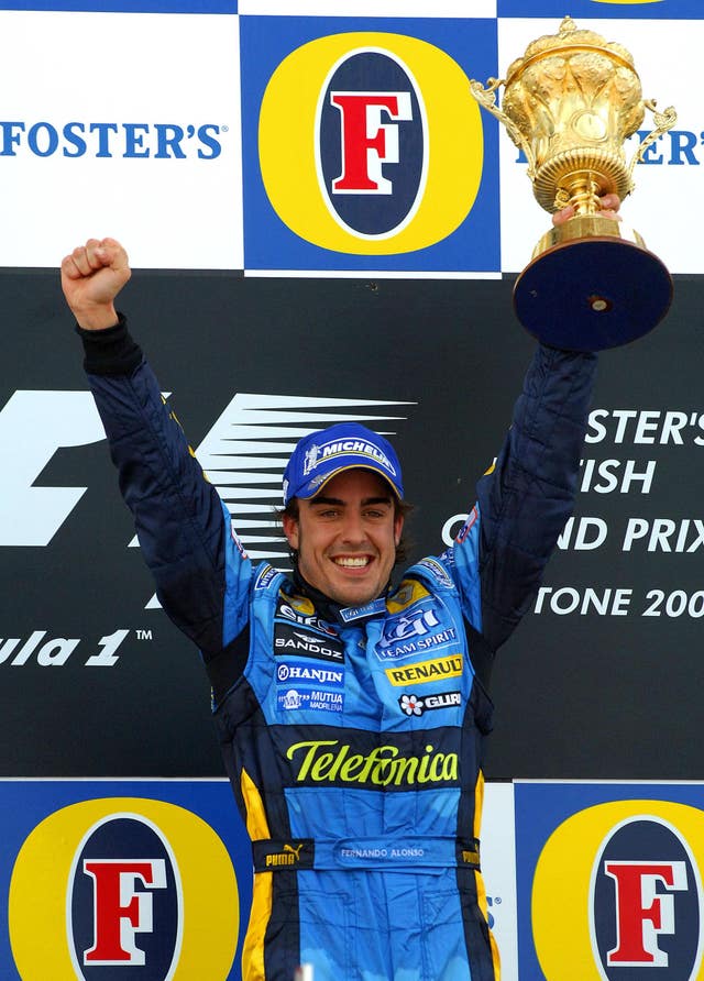 Fernando Alonso celebrates after winning the 2006 British Grand Prix