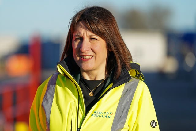 Chancellor Rachel Reeves in a yellow hi-vis jacket during a visit to Premier Modular in Driffield, Humberside