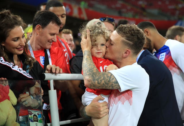 England’s Kieran Trippier celebrates with his son