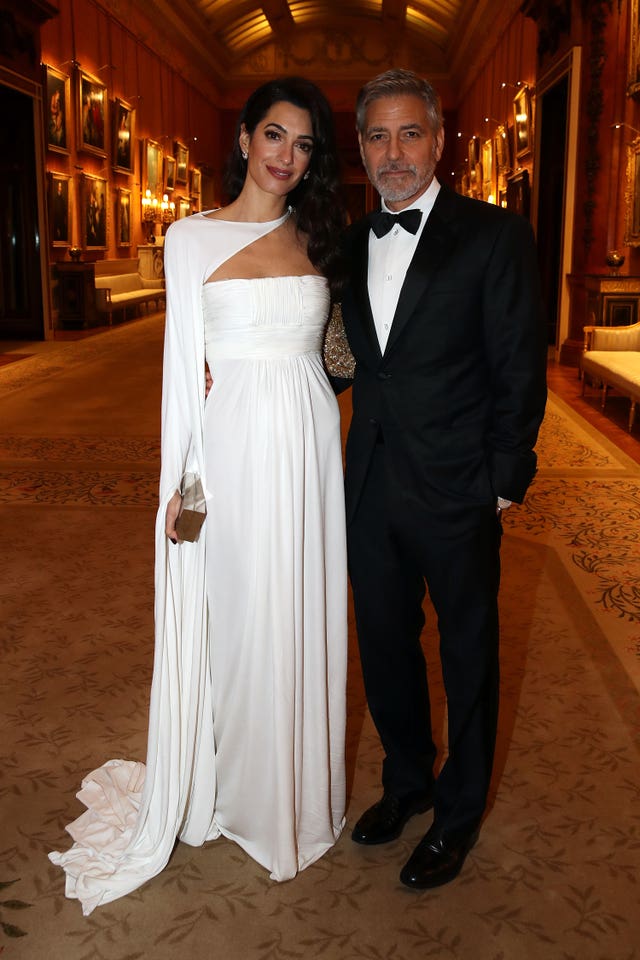 Amal Clooney and George Clooney attend a dinner for donors, supporters and ambassadors of Prince�s Trust International at Buckingham Palace in London