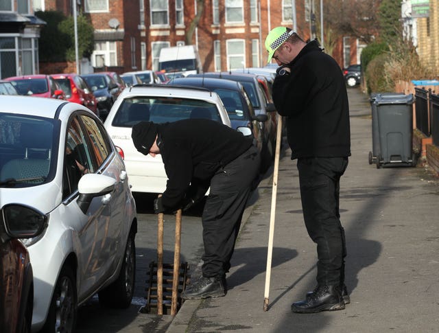 Police search street