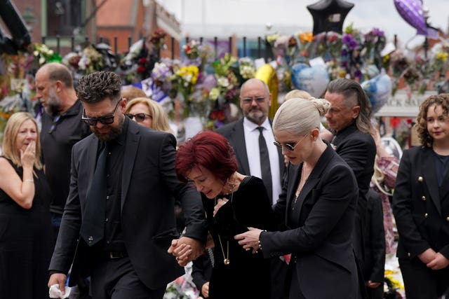 Jack, Sharon and Kelly Osbourne view messages and floral tributes