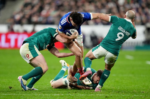 France’s Nicolas Depoortere is tackled by Ireland’s Tommy O’Brien