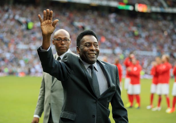 Pele waves to the crowd