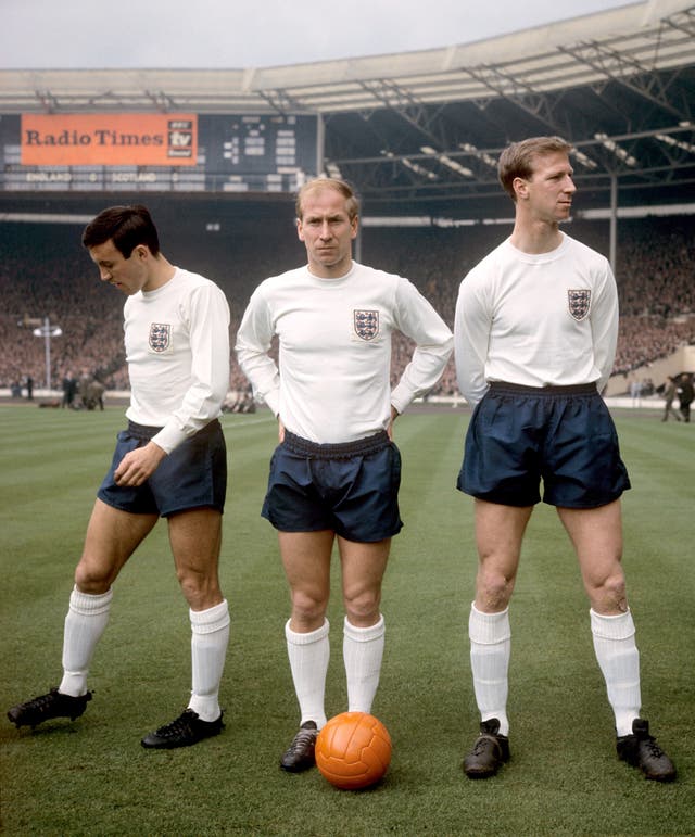 Charlton (centre) with his brother Jack (right). The pair played together for England for the first time in a 2-2 draw with Scotland in April 1965 