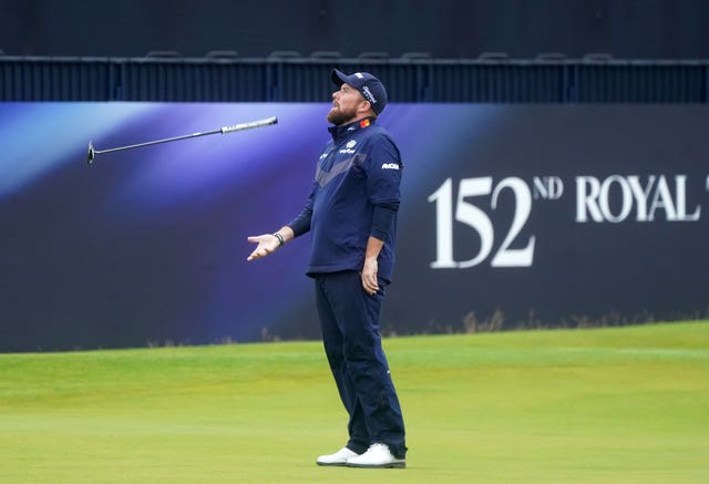 Shane Lowry throws his putter in the air