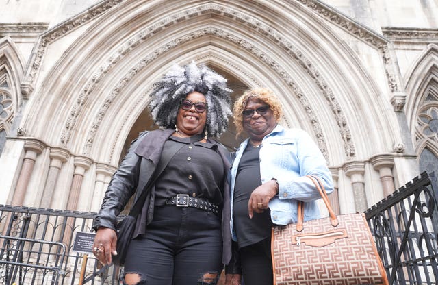 Bertice Pompe (left) and Bernadette Dugasse outside the High Court in central London