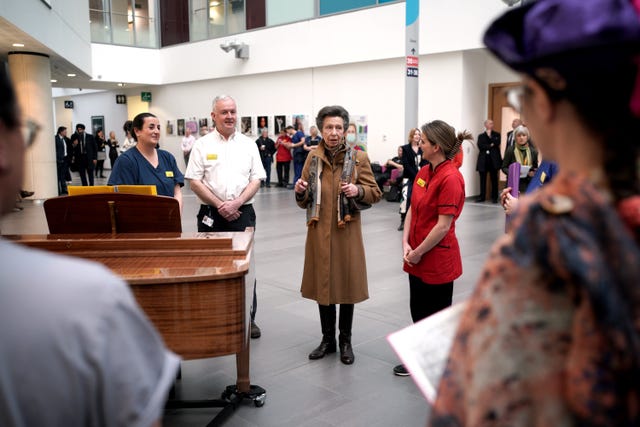 Anne speaks with the choir at the hospital who performed during her visit 