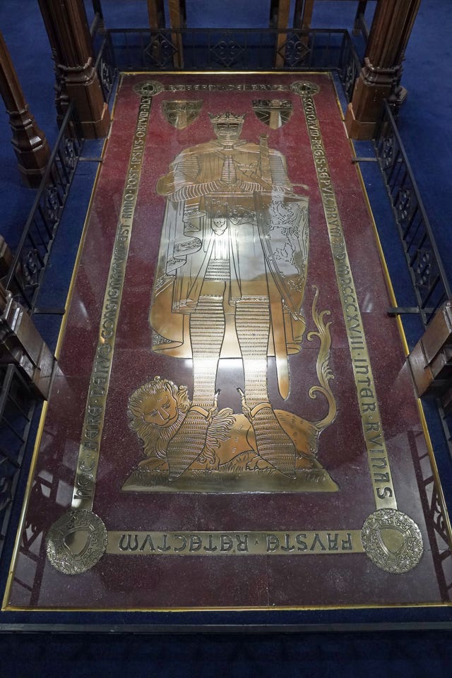 The grave stone of Robert the Bruce, as King Charles III and the Queen Consort visited Dunfermline Abbey, to mark its 950th anniversary, after attending a meeting at the City Chambers in Dunfermline, Fife, where the King formally marked the conferral of city status on the former town
