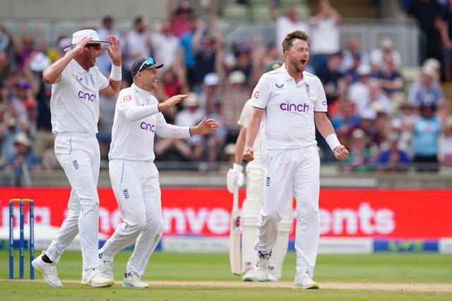 Ollie Robinson (right) offers some choice words to Usman Khawaja.