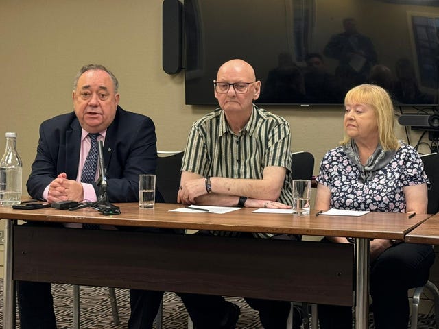 Alex Salmond sat at a table with Peter and Florence Fanning