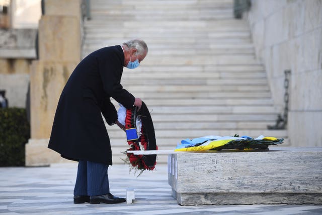 The Prince of Wales lays a wreath at the Memorial of the Unknown Soldier in Syntagma Square, Athens 
