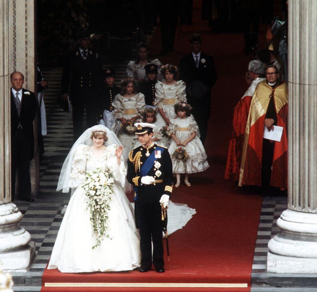 The Princess of Wales, formerly Lady Diana Spencer, waves to the crowds as she leaves St Paul’s Cathedral in London with her husband, the Prince of Wales after their wedding ceremony in 1982