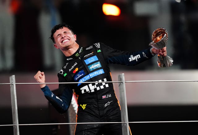 Lando Norris celebrates winning the world championship