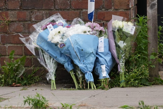 Flowers are placed near the scene of the incident