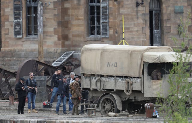 Director Sam Mendes manages the shoot at Govan Docks in Glasgow