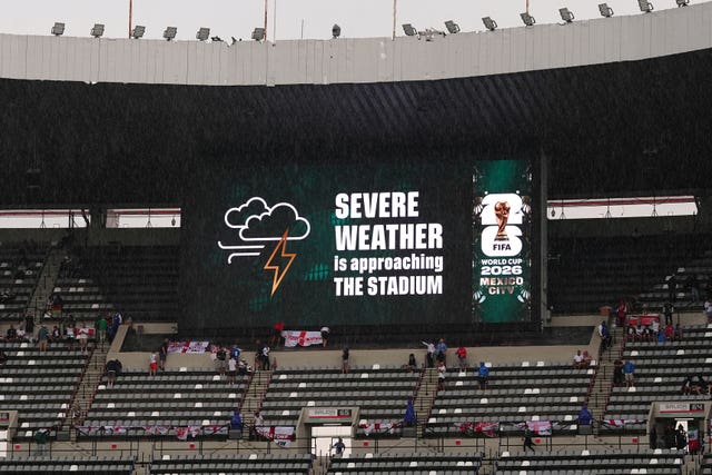A weather warning is shown on a large screen in the stadium in Mexico 
