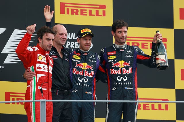 Fernando Alonso, left, Sebastian Vettel, second right, and Mark Webber, right, with Red Bull chief technical officer Adrian Newey, second left, on the podium after the 2013 Italian Grand Prix