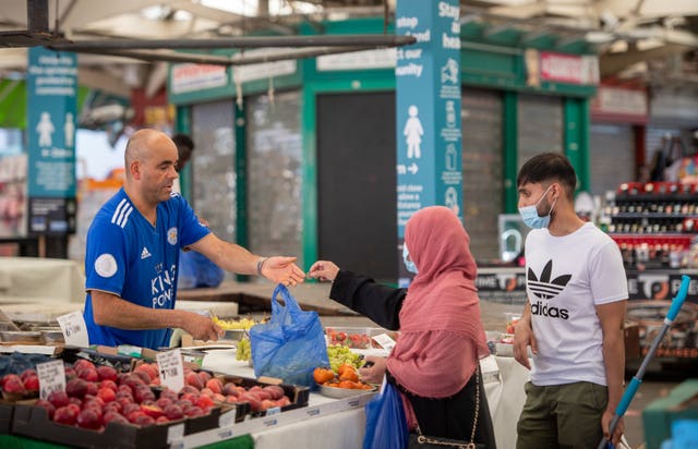 People shopping at Leicester market (Joe Giddens/PA)