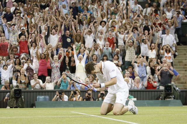 Andy Murray falls to his knees after defeating Stan Wawrinka under the centre court roof in 2009