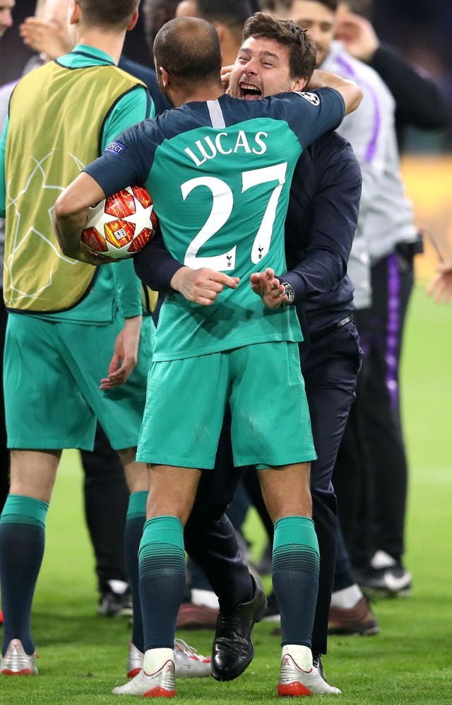 Lucas Moura (left) and manager Mauricio Pochettino celebrate after the final whistle of the Champions League semi-final in Amsterdam.