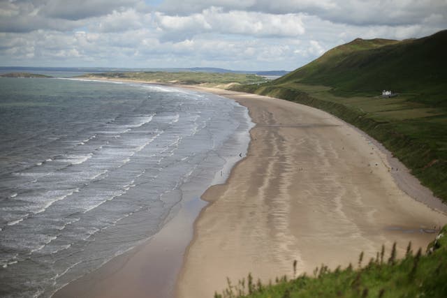 People will be able to visit beaches such as Rhossili Bay in Swansea (Yui Mok/PA)