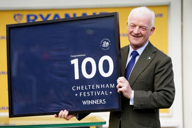 Willie Mullins with a memento at the Cheltenham Festival 