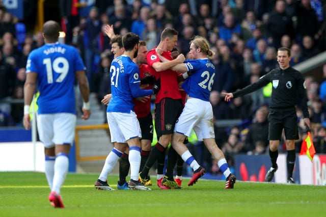 Everton’s Tom Davies, right, and Manchester United’s Nemanja Matic grapple during the two teams' Premier League draw in March 2020