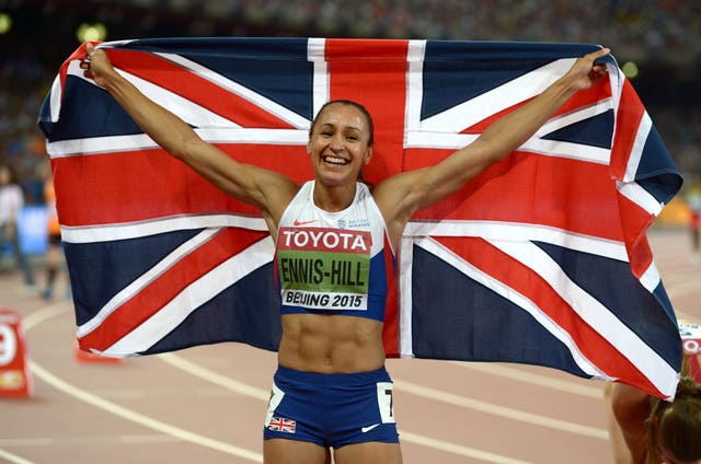 Jess Ennis-Hill holding up a Union Jack after competing at the 2012 Olympics