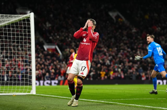 Alejandro Garnacho covers his face with his hands after missing a chance