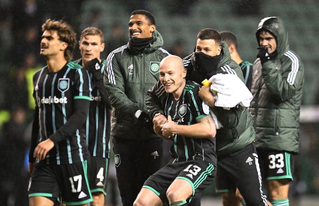 Celtic’s Aaron Mooy (centre), Moritz Jenz and goalkeeper Benjamin Siegrist celebrate with team-mates following victory in the cinch Premiership match at Easter Road, Edinburgh
