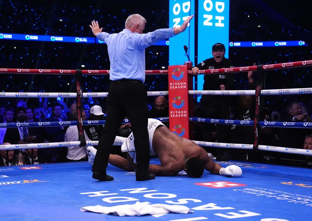 The referee stops the fight after Anthony Joshua is knocked down for a fourth time