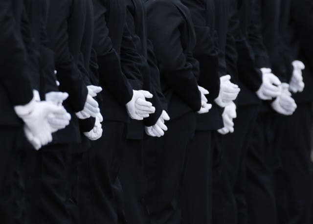 The gloved hands of recruits at the Metropolitan Police (Yui Mok/PA)