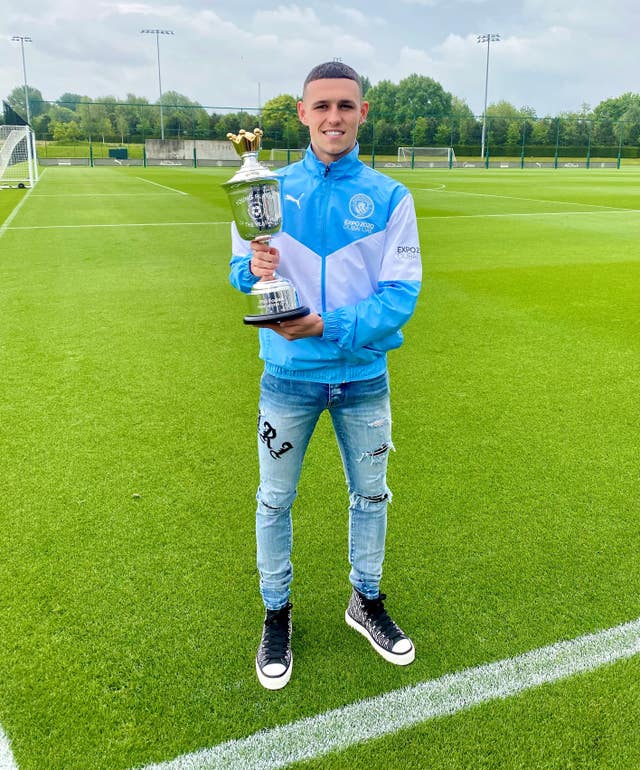 Phil Foden with the PFA Young Player of the Year trophy