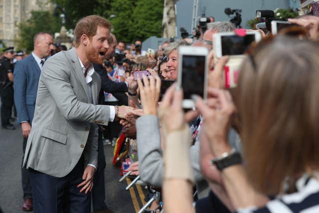 In the picture: all cameras and smartphones were trained on Harry during his 10-minute walkabout (Jonathan Brady/PA)