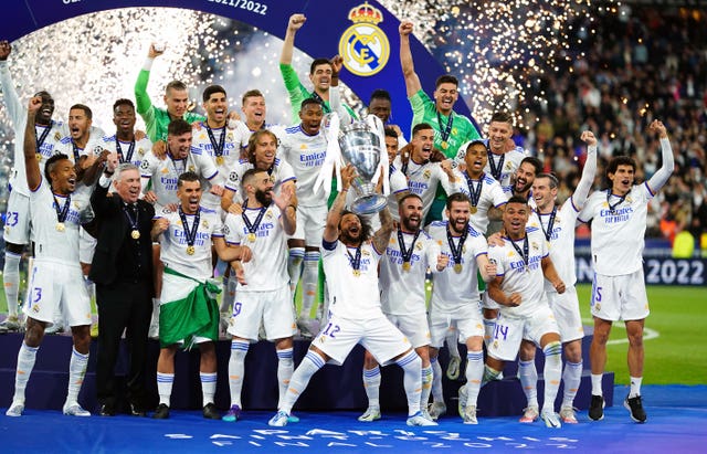 Real Madrid club captain Marcelo lifts the Champions League trophy
