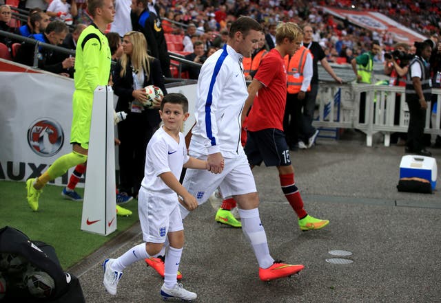 Leads out England for his first game since being officially named captain of the side by manager Roy Hodgson - Rooney scored the only goal in a friendly win over Norway.