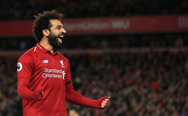 Mohamed Salah scored twice in Liverpool's win over Huddersfield to claim top-spot in the golden boot race.