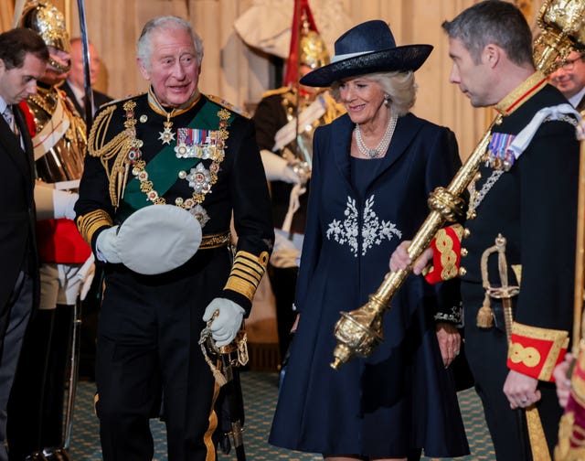 The Prince of Wales and the Duchess of Cornwall leaving the Palace of Westminster after attending the State Opening of Parliament in the House of Lords, London