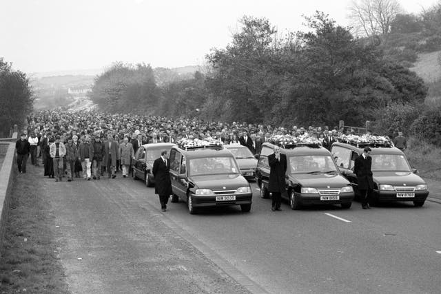 The funeral procession of three of the victims, (L/R) John Moyne, James Moore and Steven Mullan 