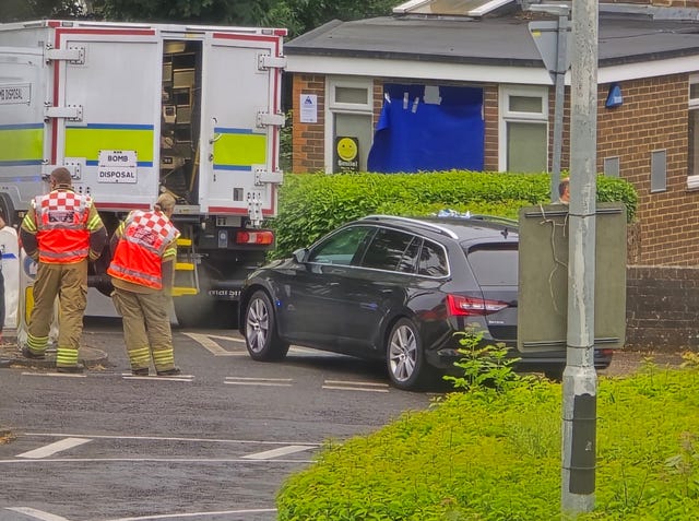 Bomb disposal experts outside the office of Jeremy Quin, an ex-defence minister and Conservative candidate for the Horsham constituency, after receiving a suspicious parcel at his Sussex office