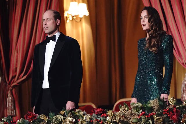 The Duke and Duchess of Cambridge sing the national anthem during the Royal Variety Performance at the Royal Albert Hall, London