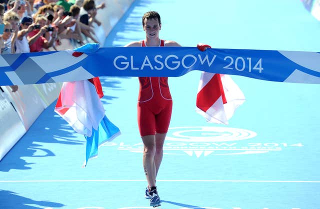 Alistair Brownlee celebrates as he crosses the line to win the men’s triathlon, at Strathclyde Country Park during the 2014 Commonwealth Games.