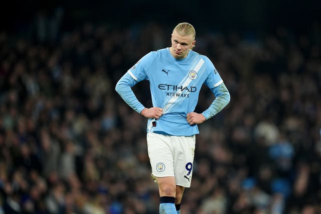 Erling Haaland with hands on hips during a game