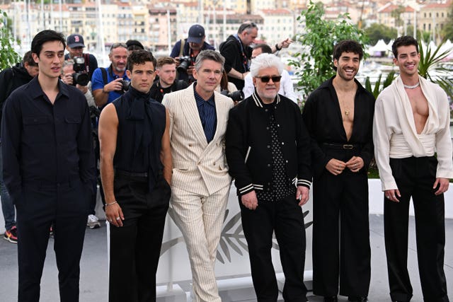 (left to right) George Steane, Jason Fernandez, Ethan Hawke, director Pedro Almodovar, Jose Condessa, and Manu Rios, attending the photocall for Strange Way of Life during the 76th Cannes Film Festival