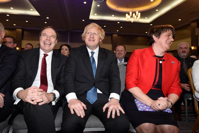 Deputy Leader of the DUP Nigel Dodds, Boris Johnson and DUP Party leader Arlene Foster during the DUP annual conference (Michael Cooper/PA)