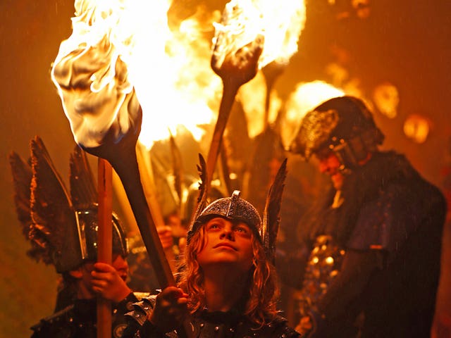The torches came out as nightfall descended (Jane Barlow/PA)